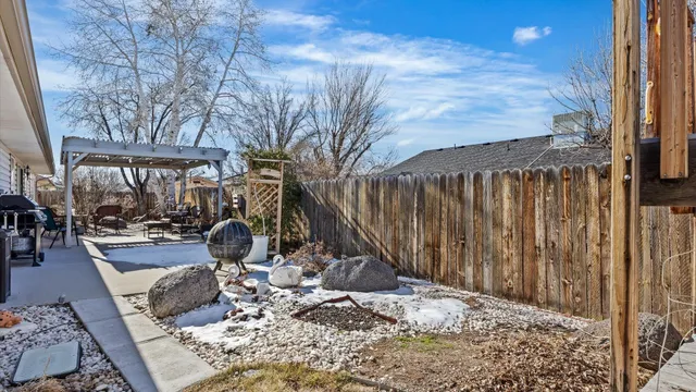 a view of a backyard with sitting area