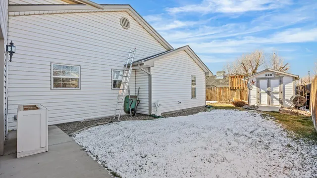 a view of a house with a yard and garage