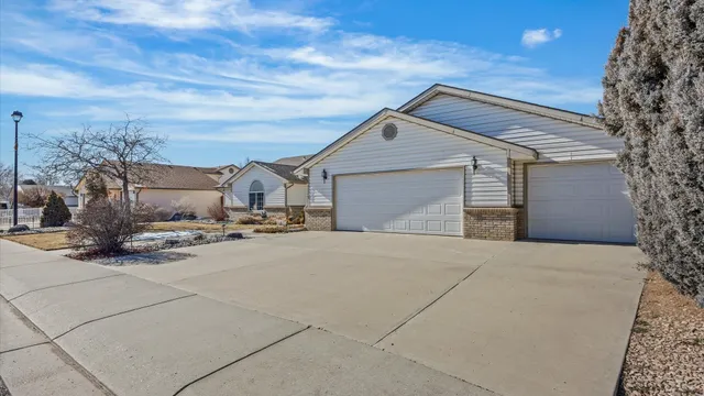 a view of a house with a snow in the yard