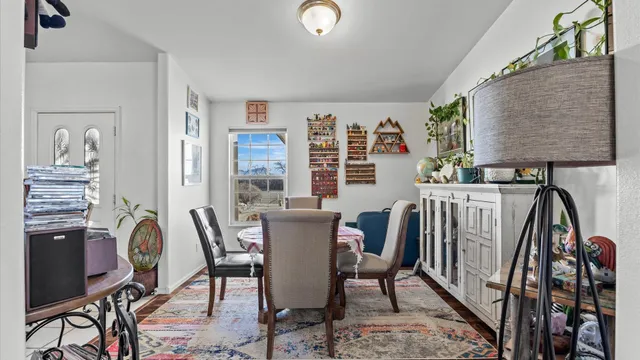 a view of a dining room with furniture and window