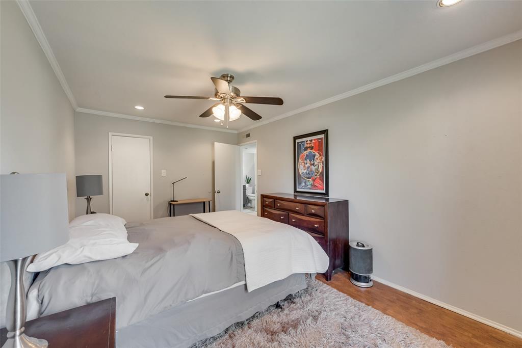 1954 Rambling Ridge Lane Carrollton, TX 75007 - Photo 10 of 20 Recessed lighting illuminates this interior space, featuring crown molding and wood-finish flooring