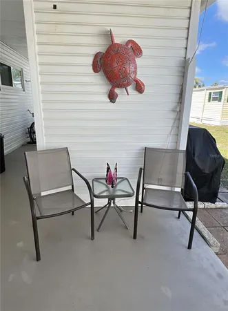 a living room with furniture and a chair