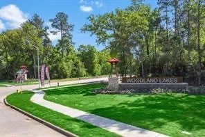 a view of a backyard with large trees