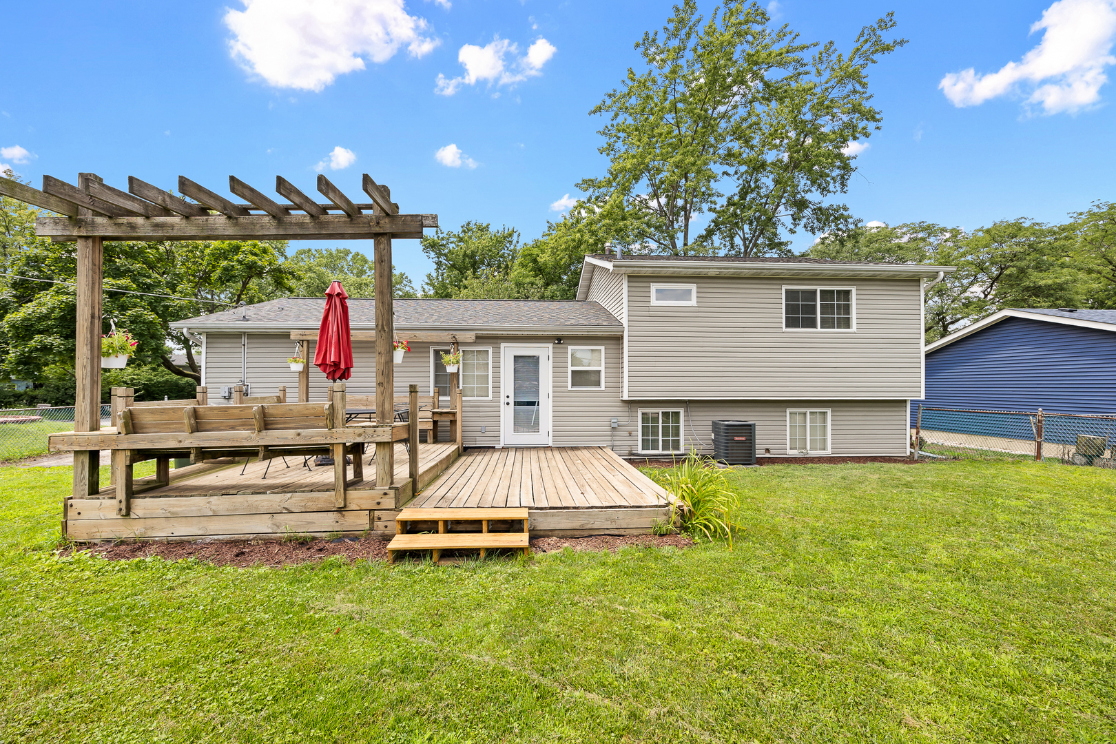 148 Bedford Road Bolingbrook, IL 60440 - Photo 4 of 32 a view of a house with pool and chairs