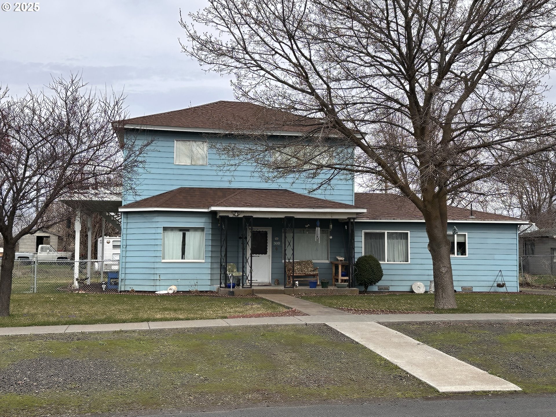 309 East Van Buren Street Athena, OR 97813 - Photo 1 of 31 a front view of a house with a garden