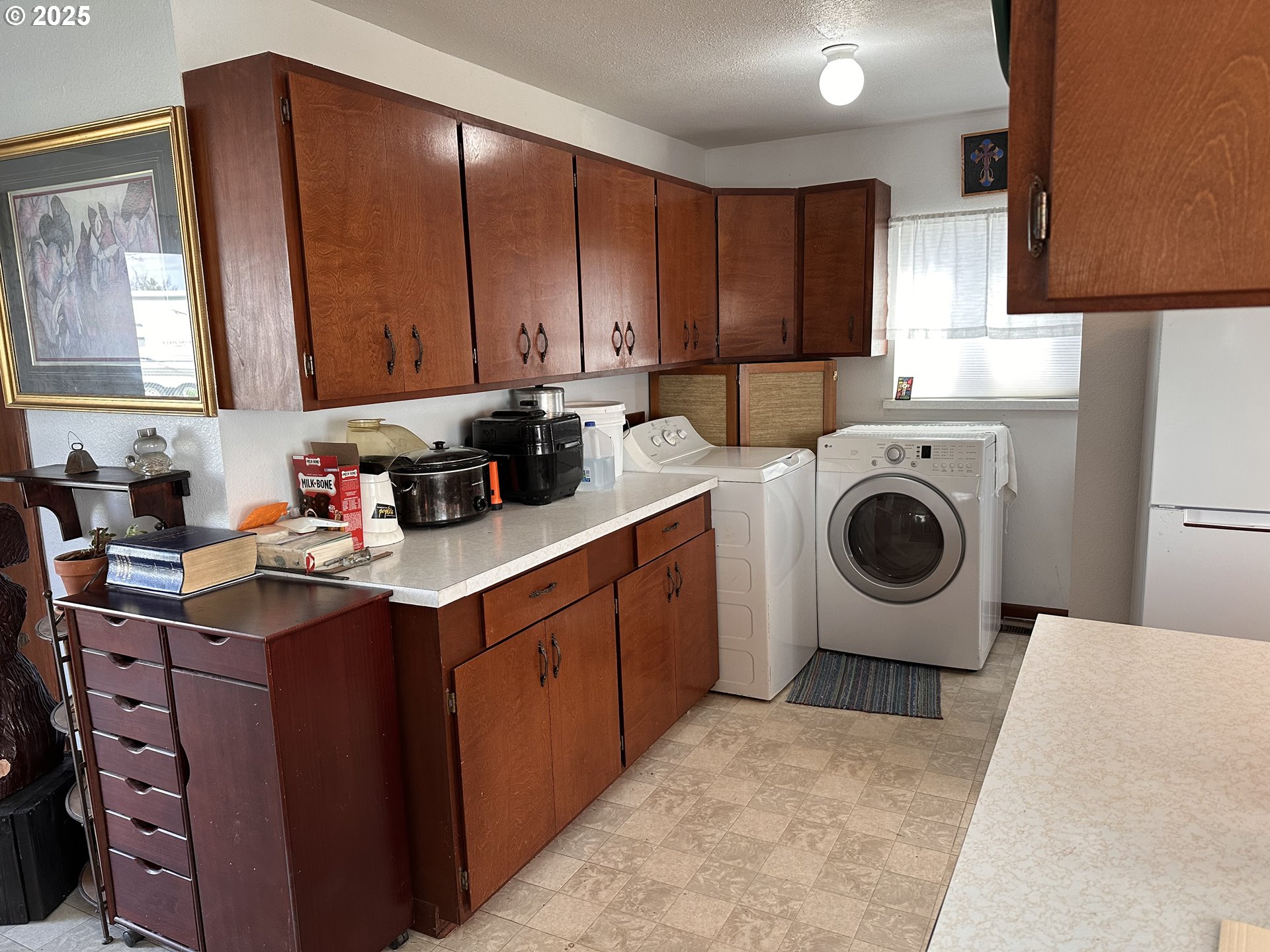 309 East Van Buren Street Athena, OR 97813 - Photo 14 of 31 a kitchen with a sink a stove and cabinets