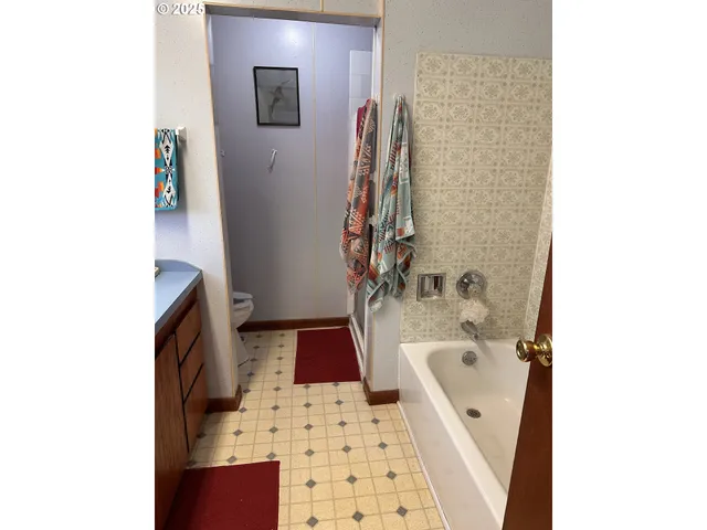 a bathroom with a bathtub and a sink