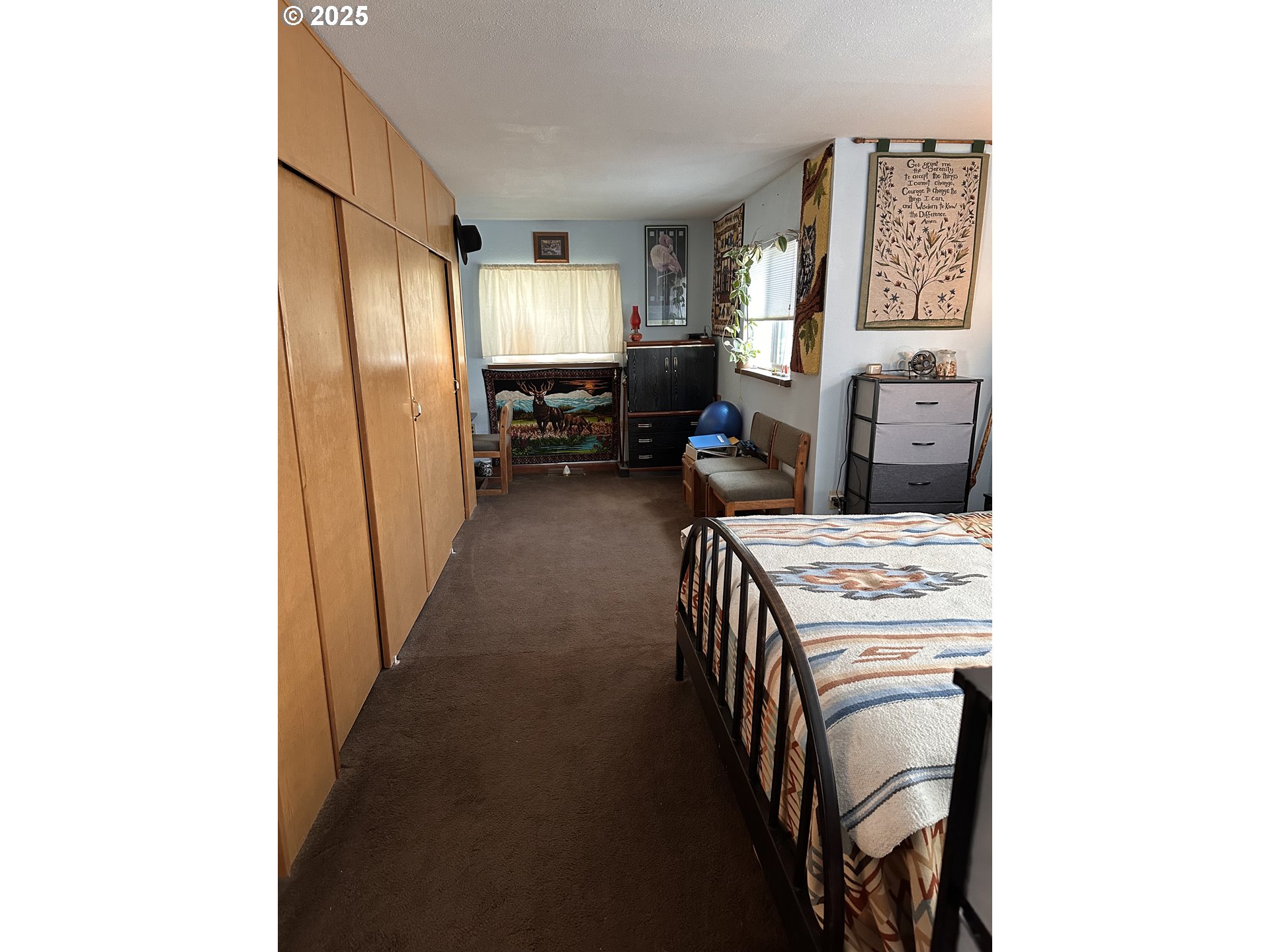 309 East Van Buren Street Athena, OR 97813 - Photo 20 of 31 a view of a hallway to a livingroom with furniture and windows