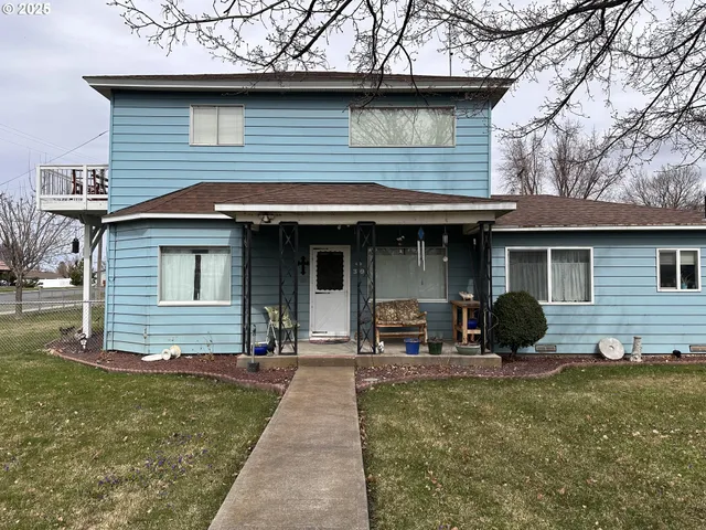 a front view of a house with yard