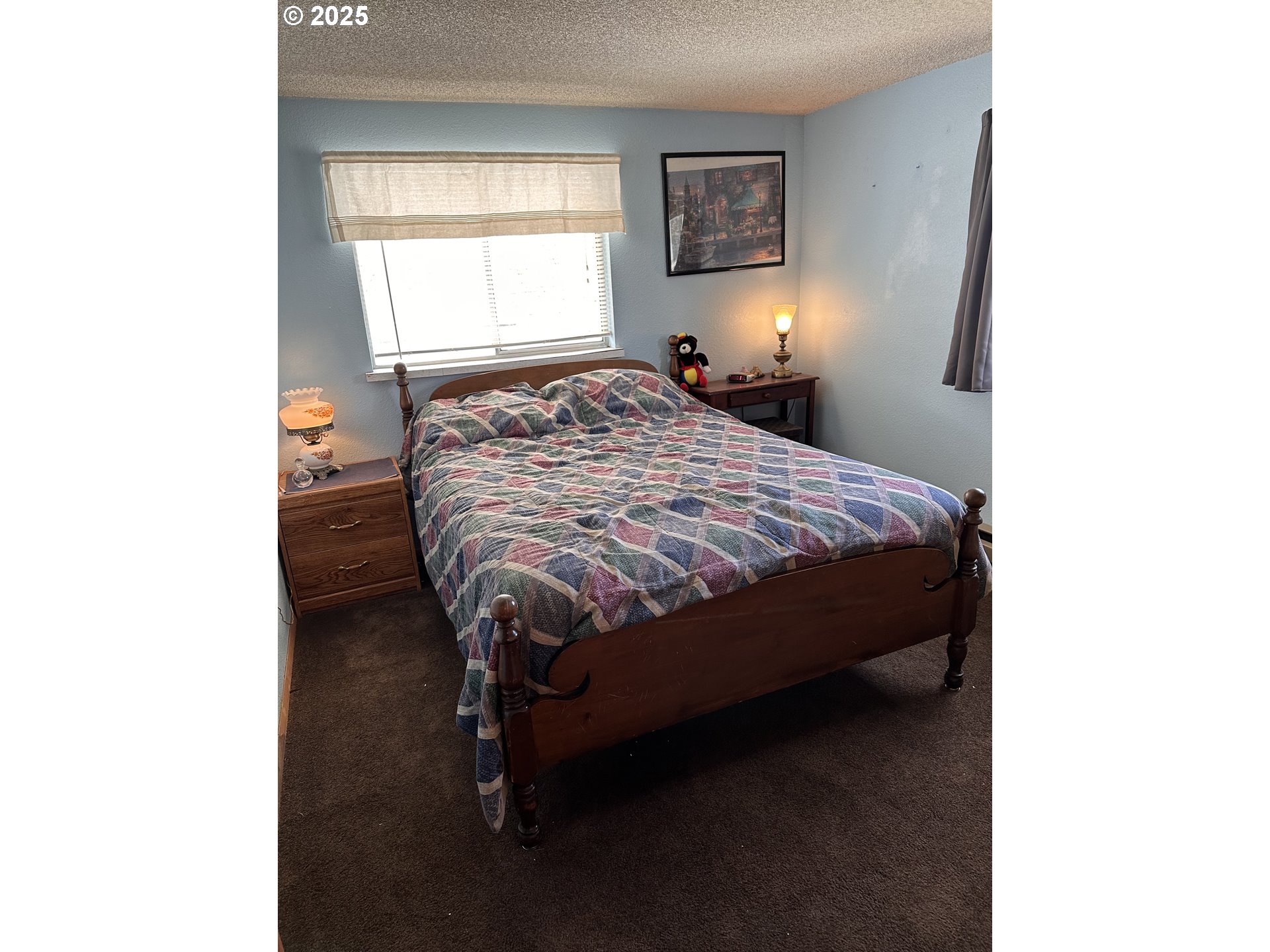 309 East Van Buren Street Athena, OR 97813 - Photo 24 of 31 a bed sitting in a bedroom next to a window