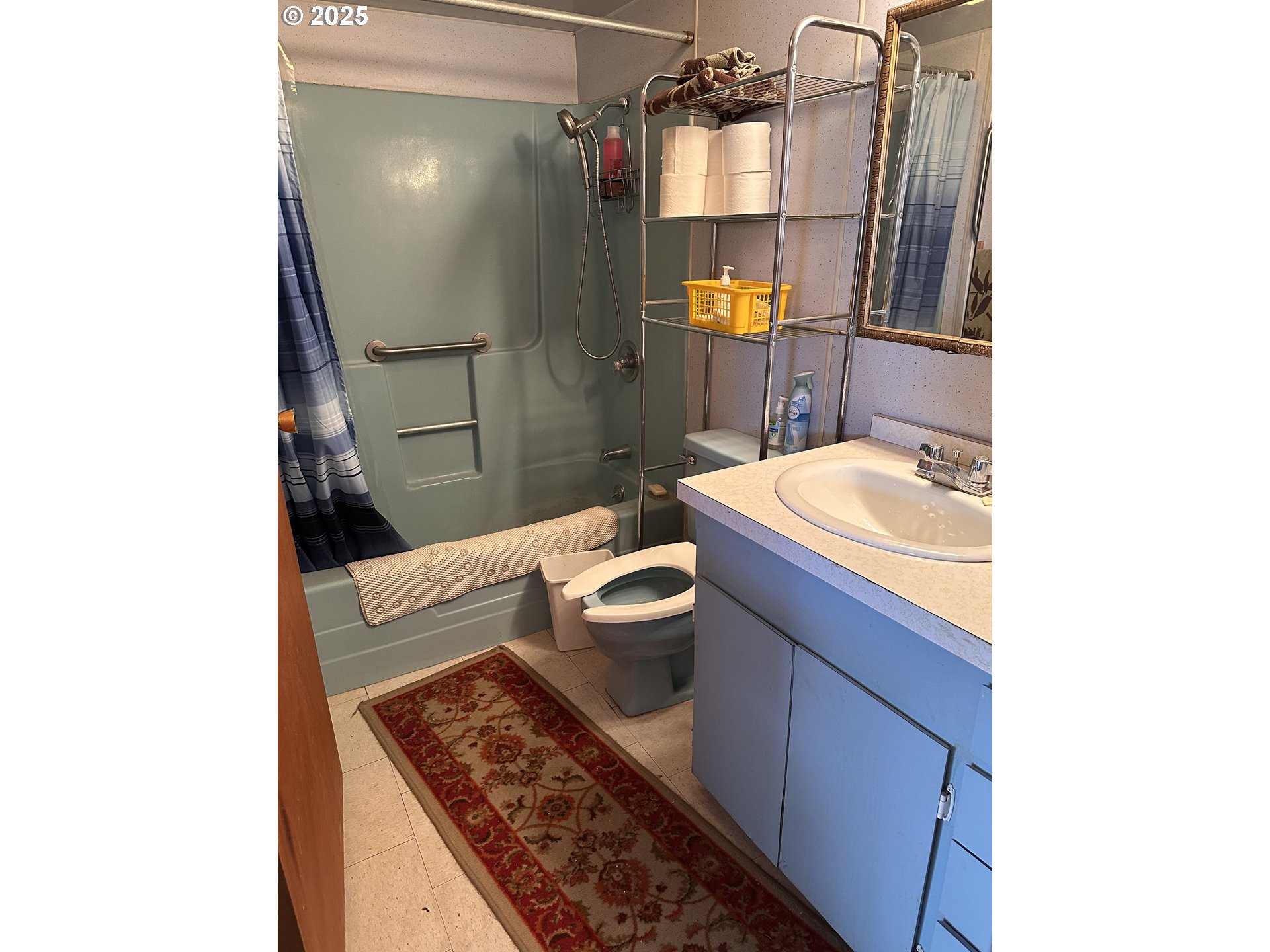 309 East Van Buren Street Athena, OR 97813 - Photo 25 of 31 a bathroom with a granite countertop sink a toilet and shower
