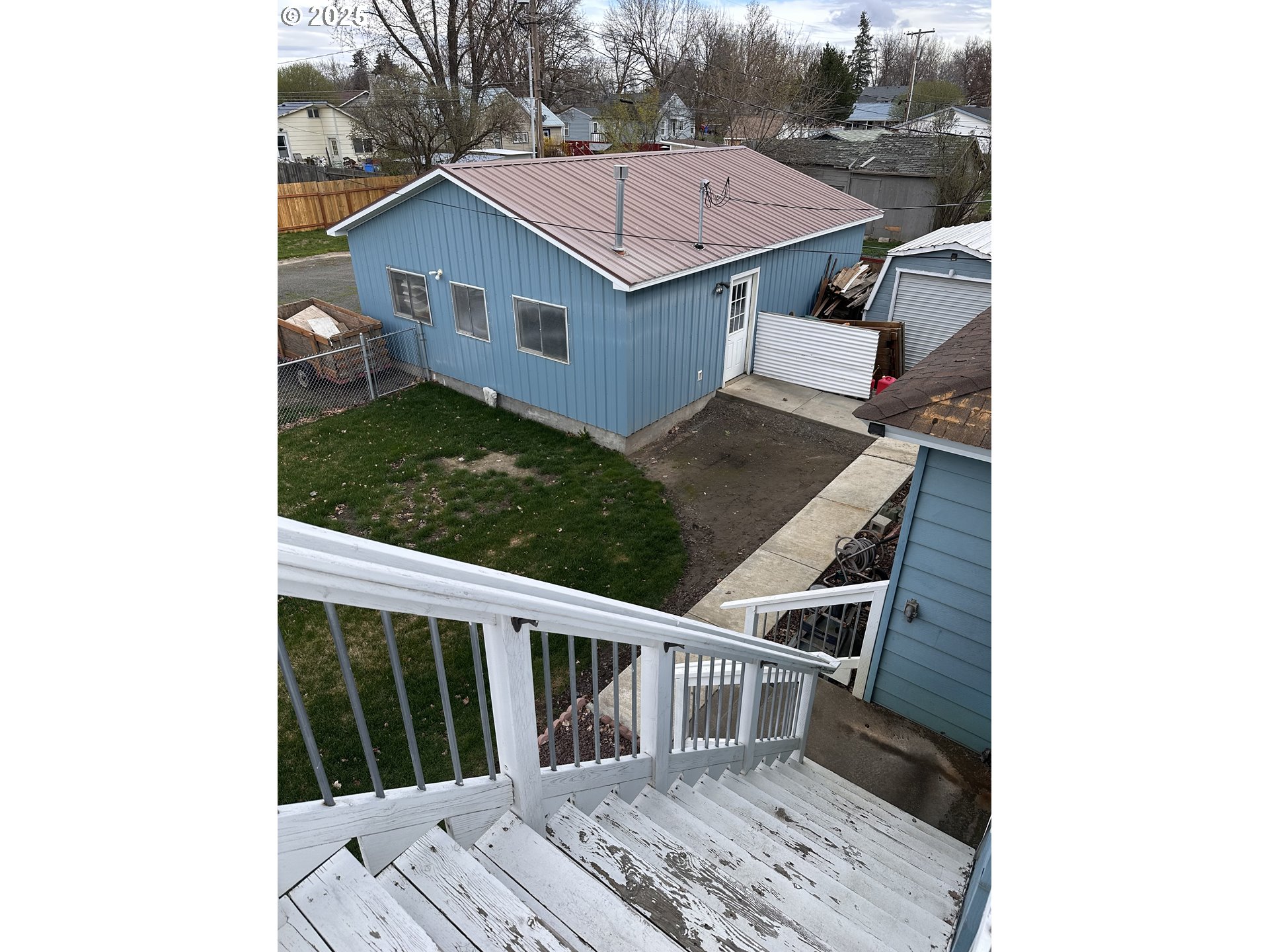 309 East Van Buren Street Athena, OR 97813 - Photo 28 of 31 a view of a house with a balcony and wooden fence