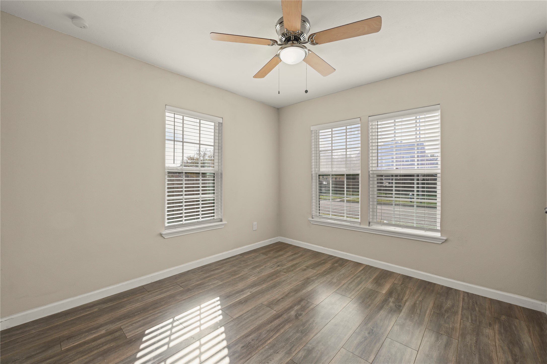 2803 Cleburne Street, Unit 3 Houston, TX 77004 - Photo 5 of 8 a view of an empty room with wooden floor and a window
