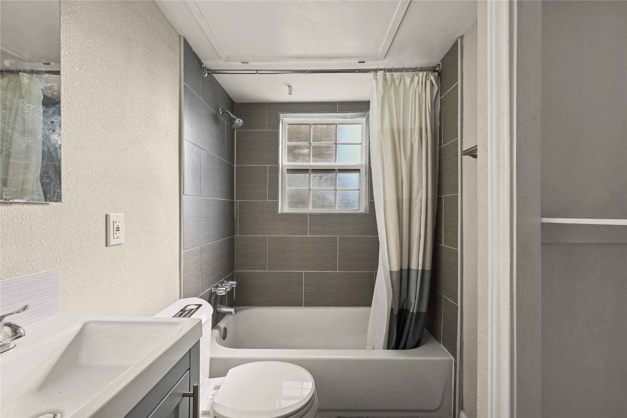 2803 Cleburne Street, Unit 3 Houston, TX 77004 - Photo 6 of 8 a bathroom with a tub toilet and sink