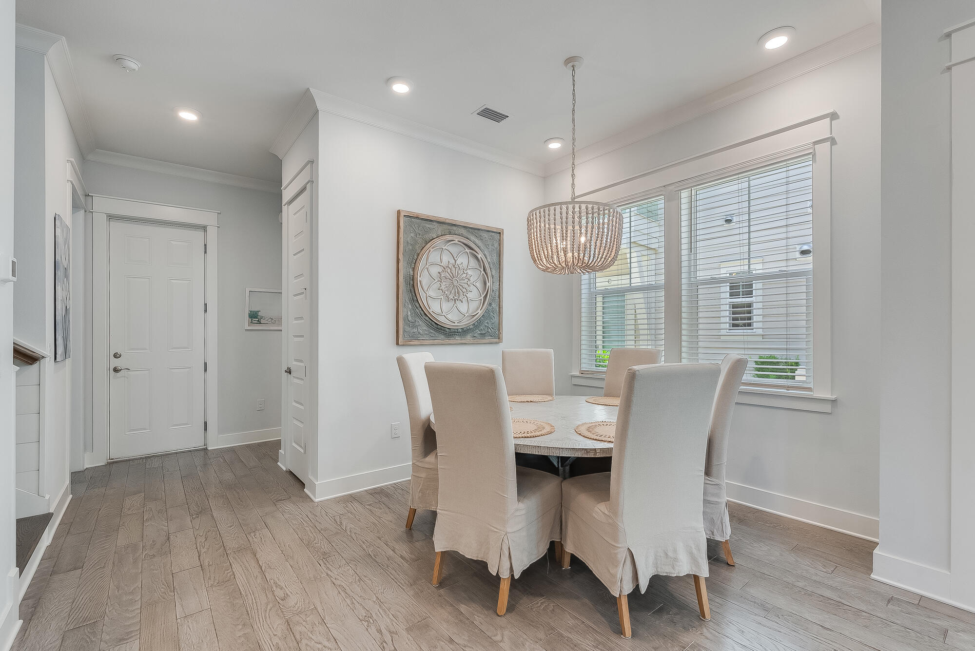 239 Milestone Drive, Unit A Inlet Beach, FL 32461 - Photo 17 of 39 a view of a dining room with furniture window and wooden floor