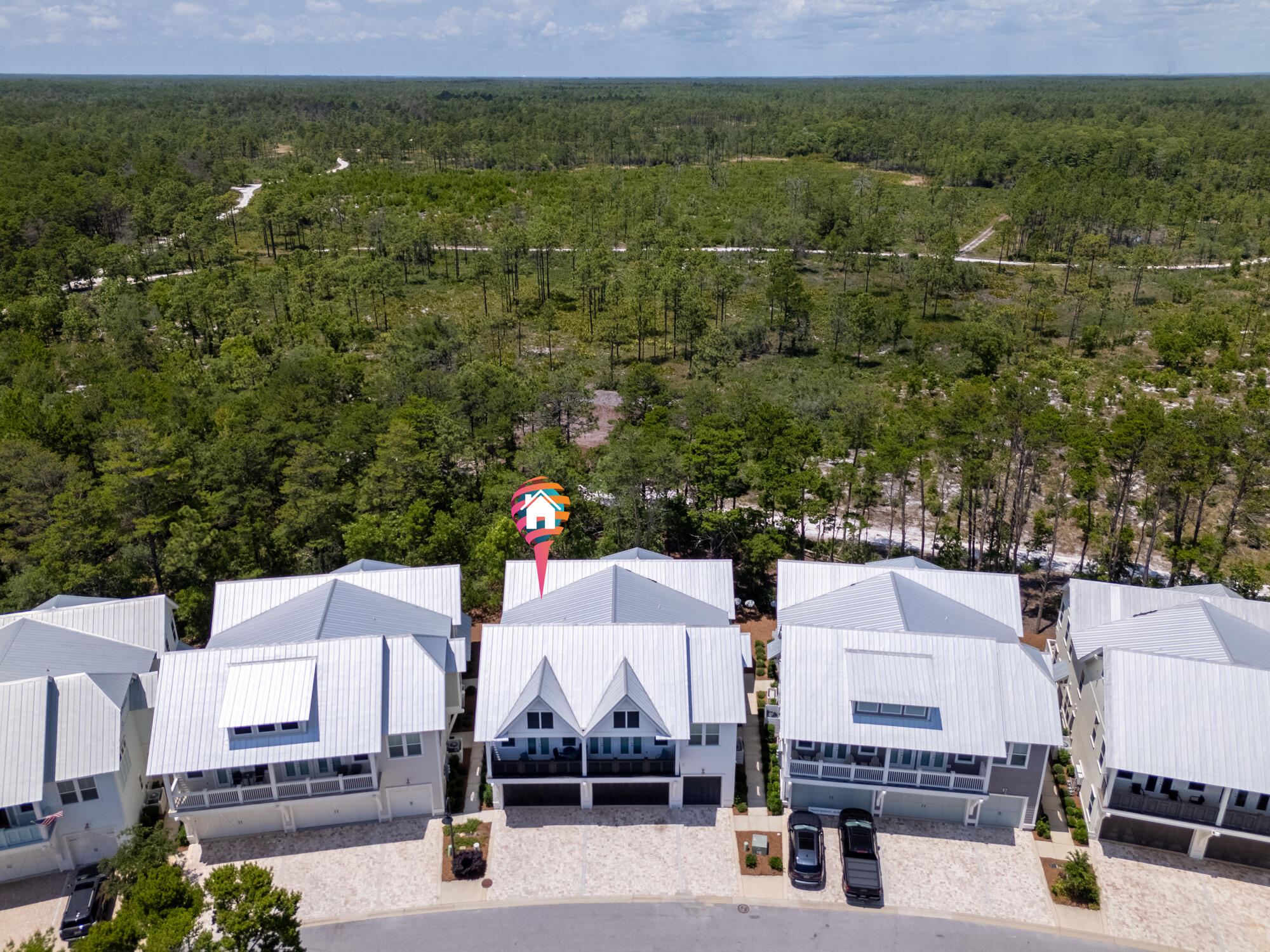 239 Milestone Drive, Unit A Inlet Beach, FL 32461 - Photo 28 of 39 an aerial view of a city with lots of residential buildings