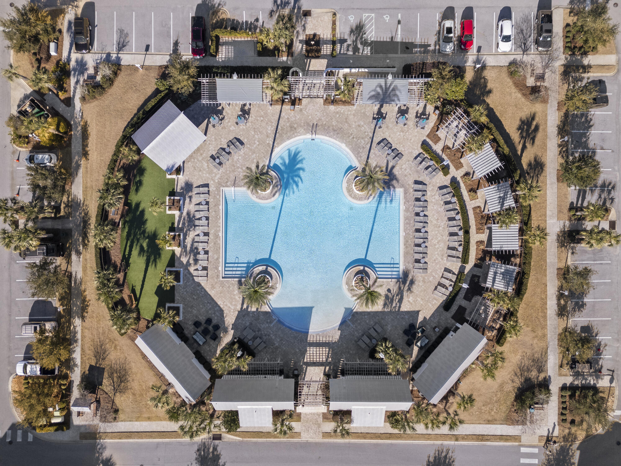 239 Milestone Drive, Unit A Inlet Beach, FL 32461 - Photo 36 of 39 an aerial view of a building with streets and lounge chairs