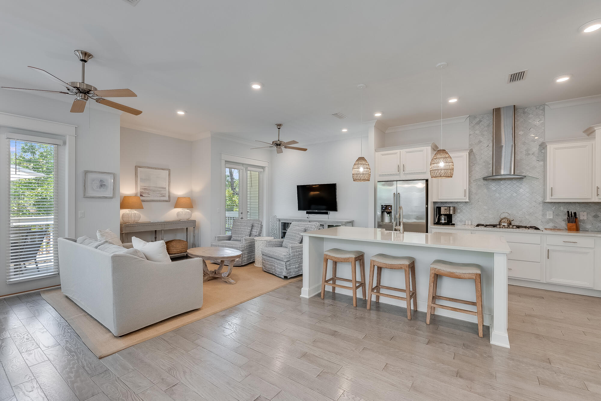 239 Milestone Drive, Unit A Inlet Beach, FL 32461 - Photo 5 of 39 a living room with furniture a flat screen tv and kitchen view
