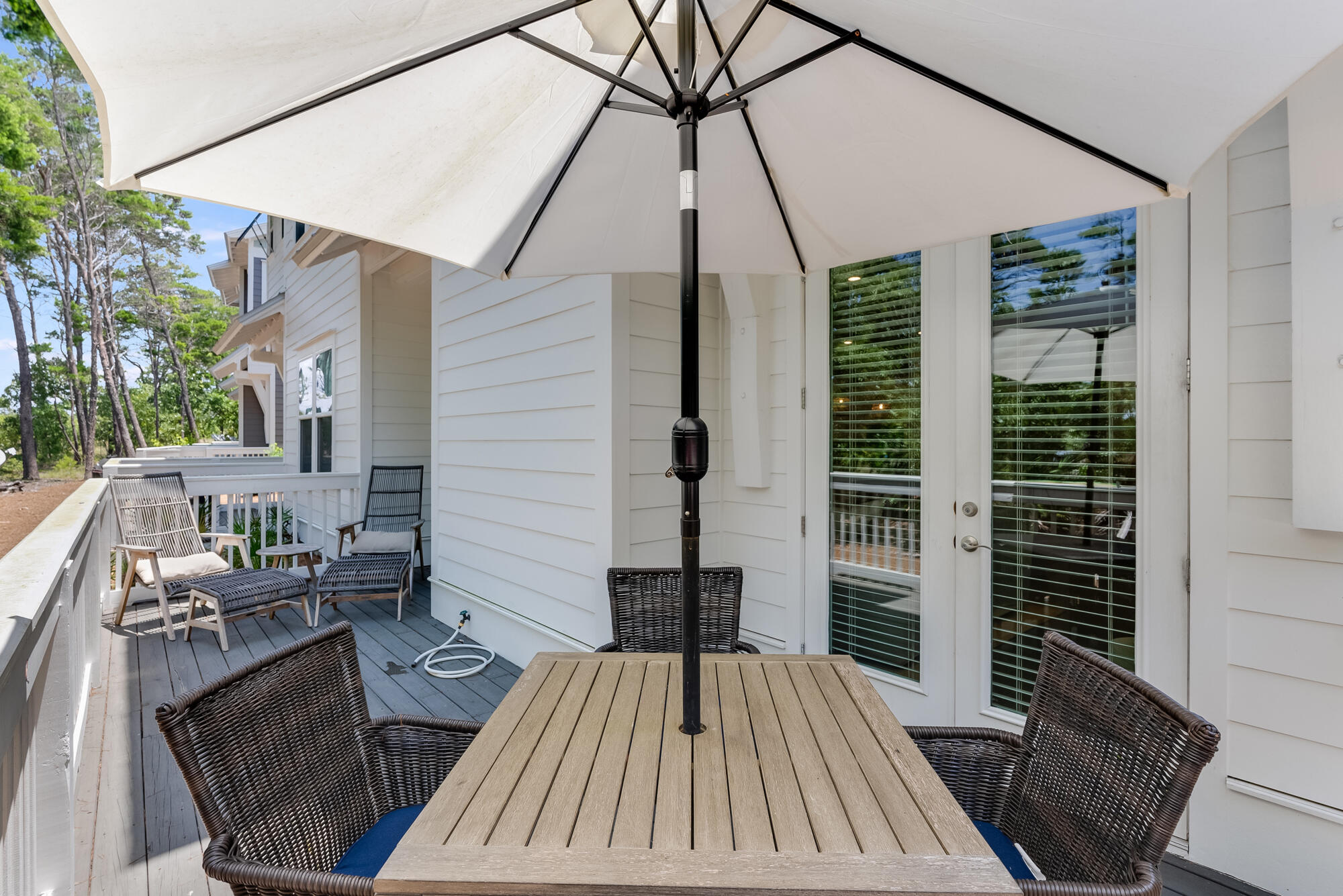 239 Milestone Drive, Unit A Inlet Beach, FL 32461 - Photo 8 of 39 a view of balcony with a couch and wooden floor