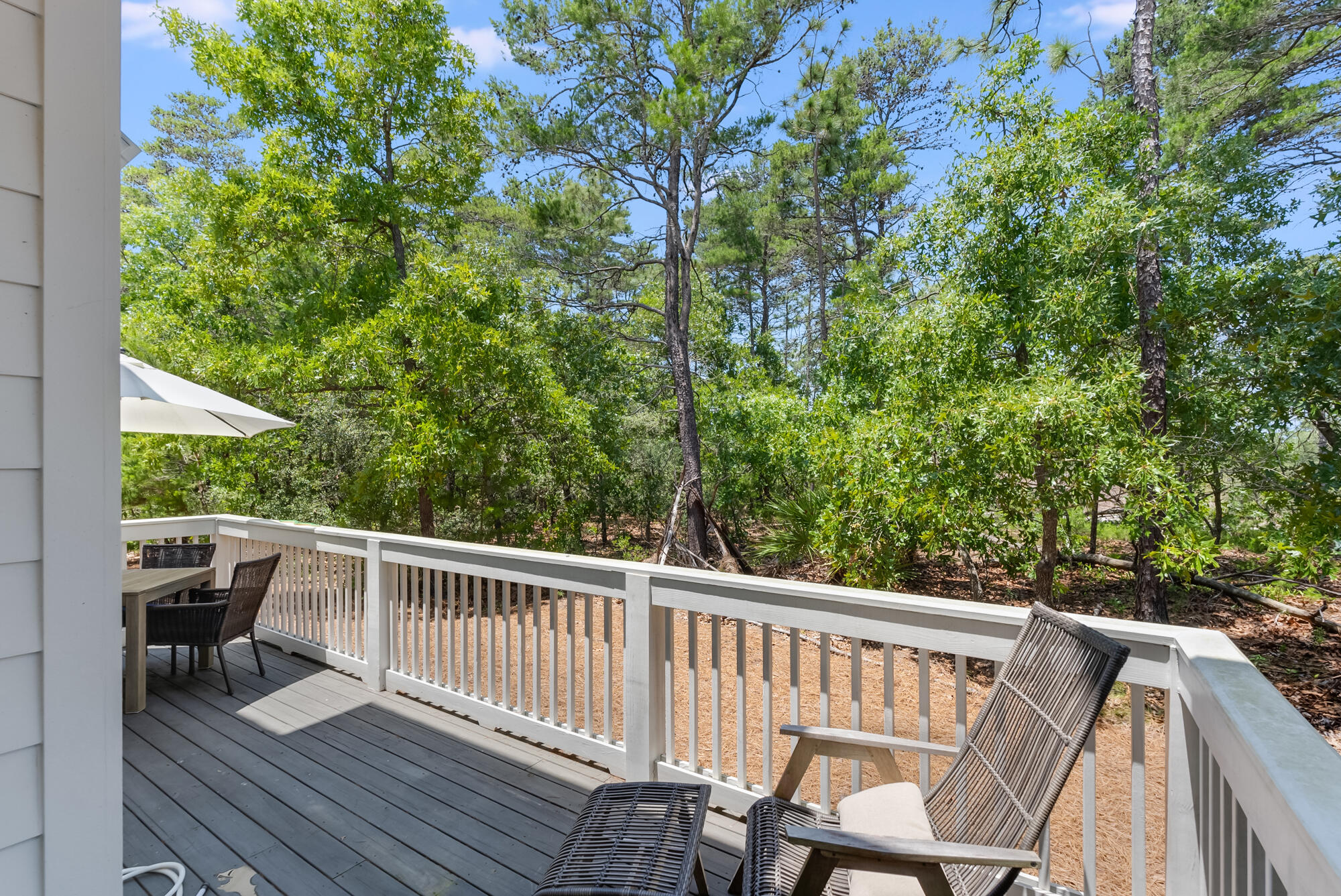 239 Milestone Drive, Unit A Inlet Beach, FL 32461 - Photo 9 of 39 a view of a two chairs in the balcony
