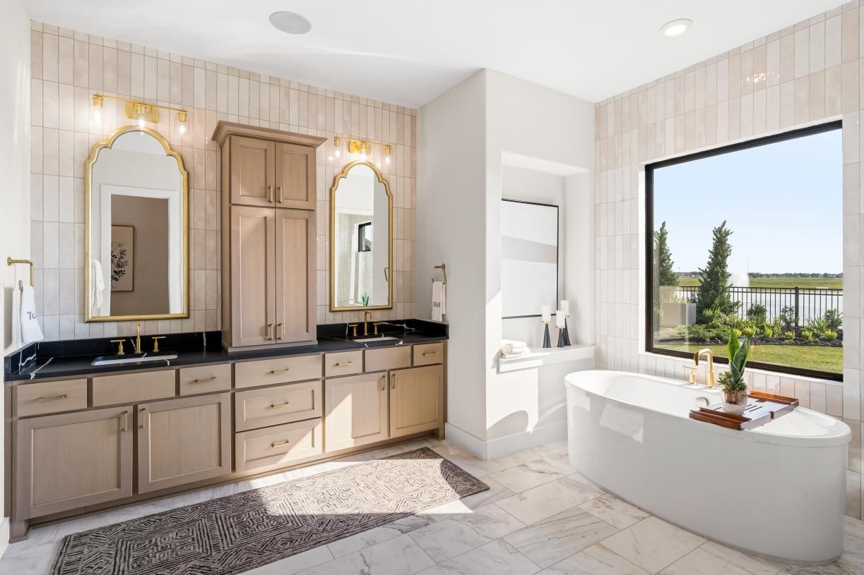 4633 Sterling Spgs Drive Spring, TX 77386 - Photo 9 of 24 a large spacious bathroom with a granite countertop tub double vanity mirror and a sink