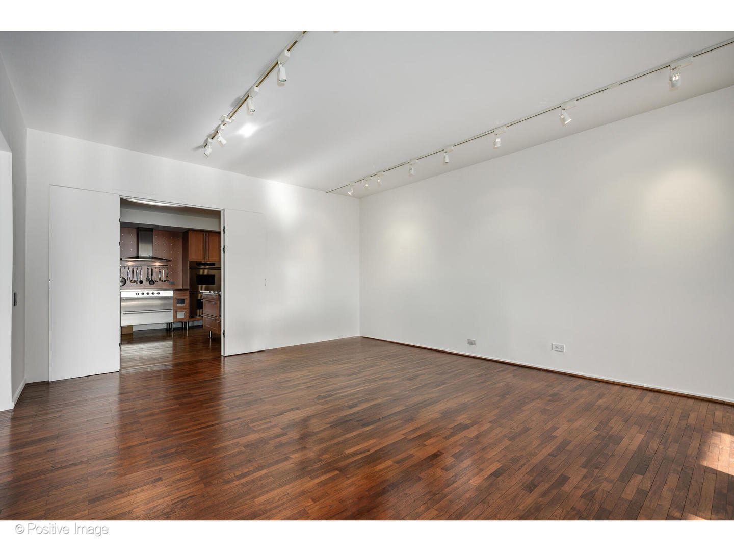 175 East Delaware Place, Unit 5116 Chicago, IL 60611 - Photo 11 of 43 a view of empty room with wooden floor