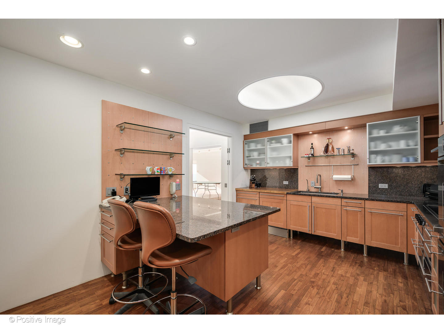 175 East Delaware Place, Unit 5116 Chicago, IL 60611 - Photo 14 of 43 a kitchen with stainless steel appliances granite countertop a sink and cabinets