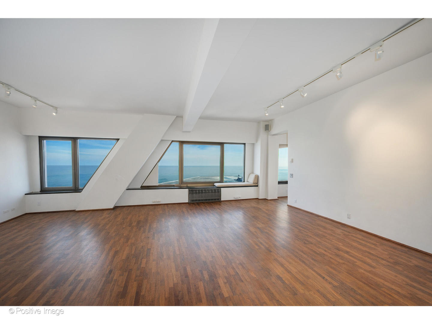 175 East Delaware Place, Unit 5116 Chicago, IL 60611 - Photo 20 of 43 a view of an empty room with wooden floor and cabinet