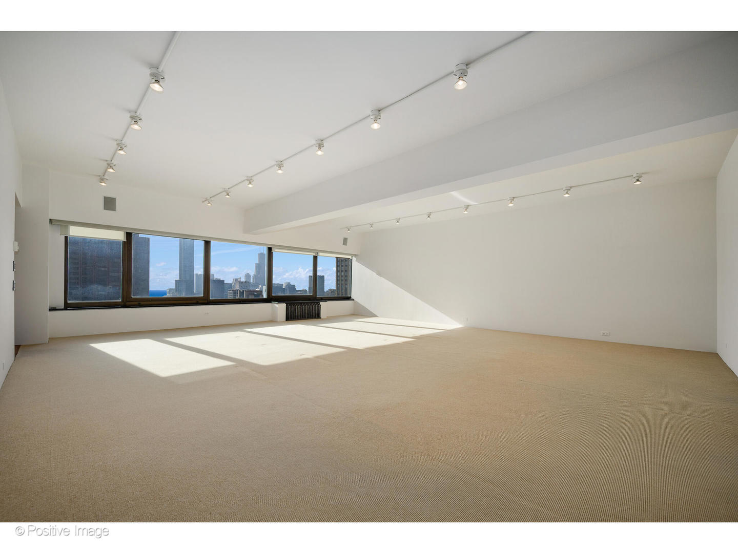 175 East Delaware Place, Unit 5116 Chicago, IL 60611 - Photo 24 of 43 a view of empty room with wooden floor