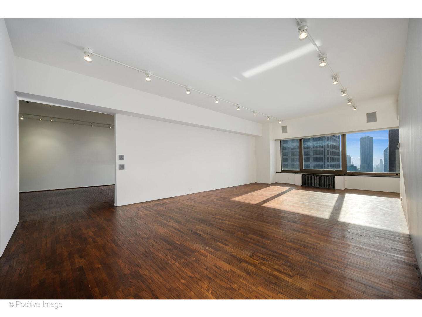 175 East Delaware Place, Unit 5116 Chicago, IL 60611 - Photo 5 of 43 a view of empty room with wooden floor
