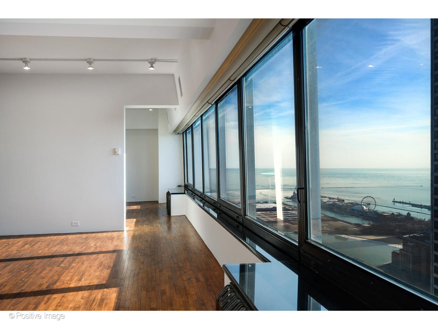 175 East Delaware Place, Unit 5116 Chicago, IL 60611 - Photo 6 of 43 a view of a room with wooden floor