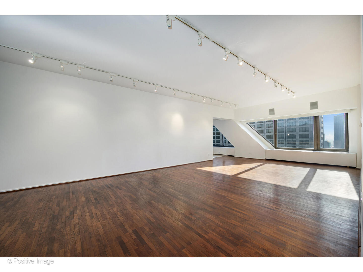 175 East Delaware Place, Unit 5116 Chicago, IL 60611 - Photo 8 of 43 a view of an empty room with wooden floor