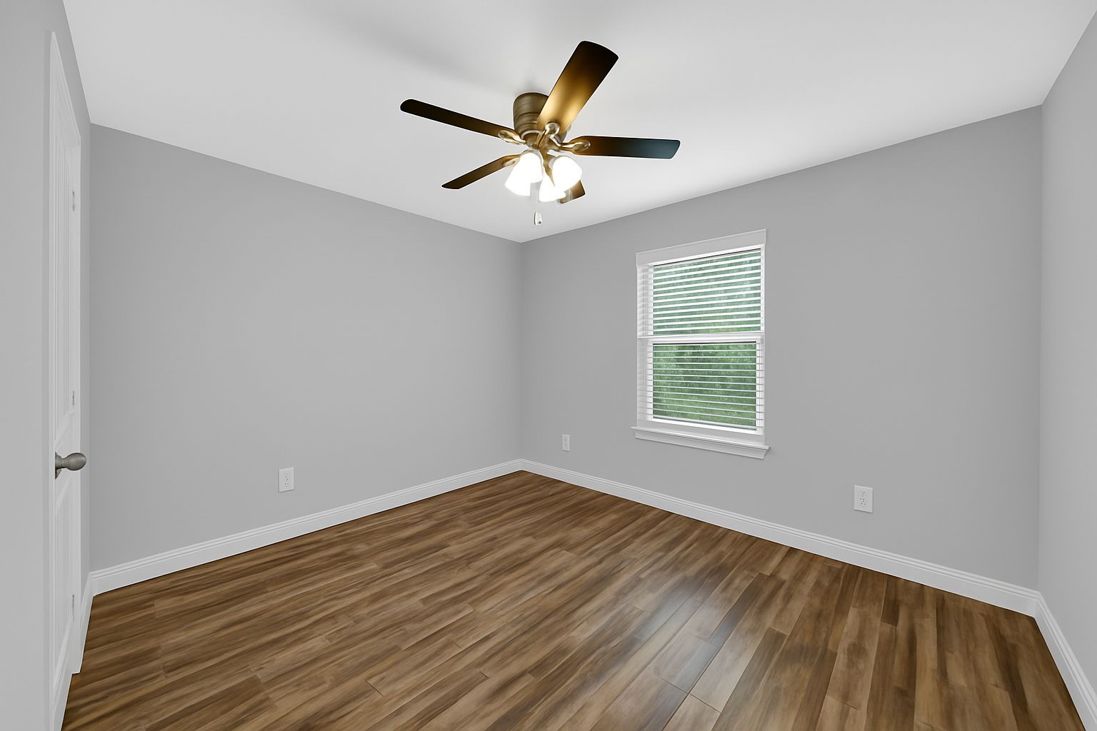 4732 Carmen Street, Unit A Houston, TX 77033 - Photo 15 of 26 a view of a room with wooden floor and ceiling fan