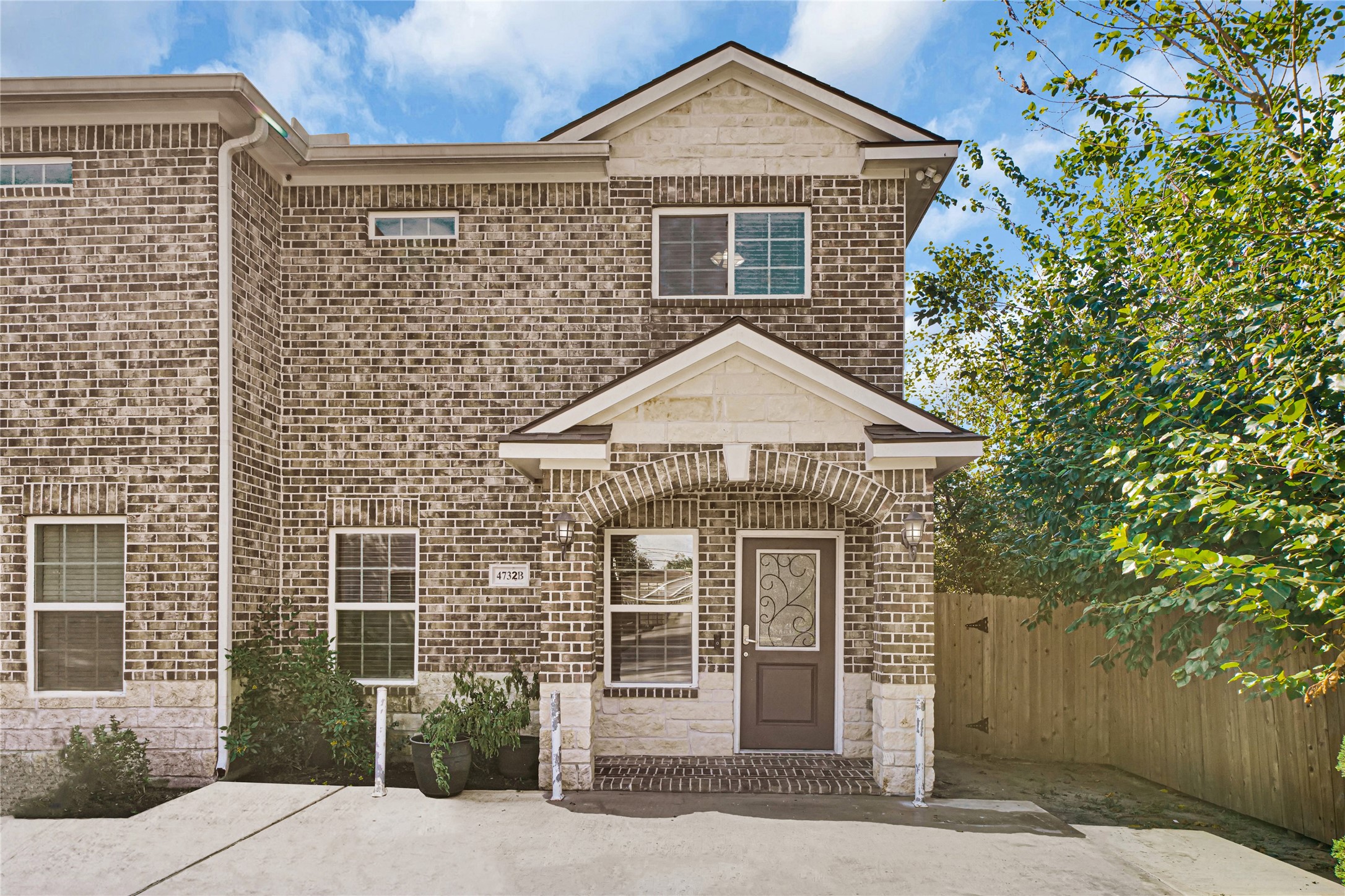 4732 Carmen Street, Unit A Houston, TX 77033 - Photo 2 of 26 a front view of a house with garden