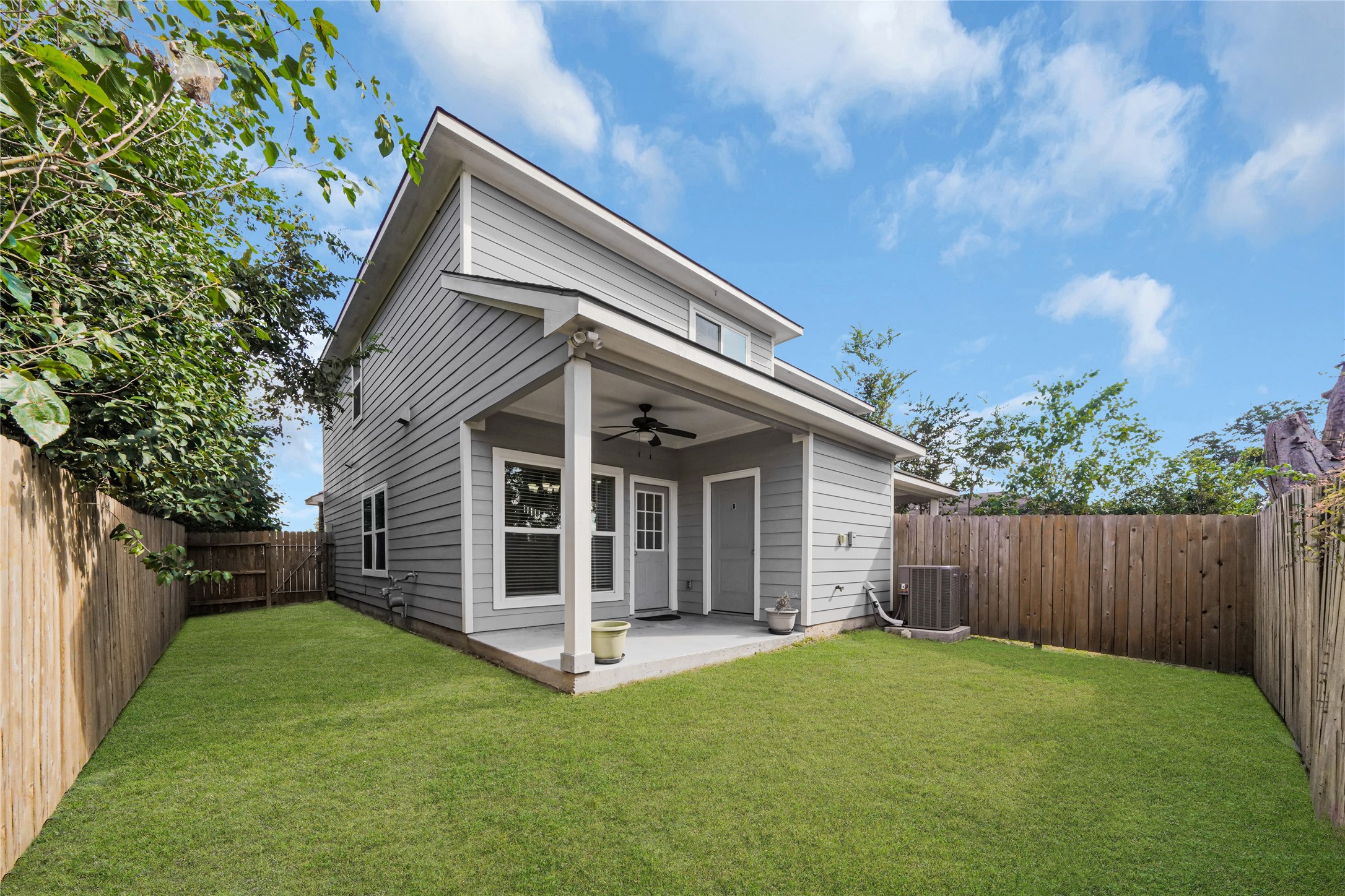 4732 Carmen Street, Unit A Houston, TX 77033 - Photo 25 of 26 a view of a house with backyard and porch