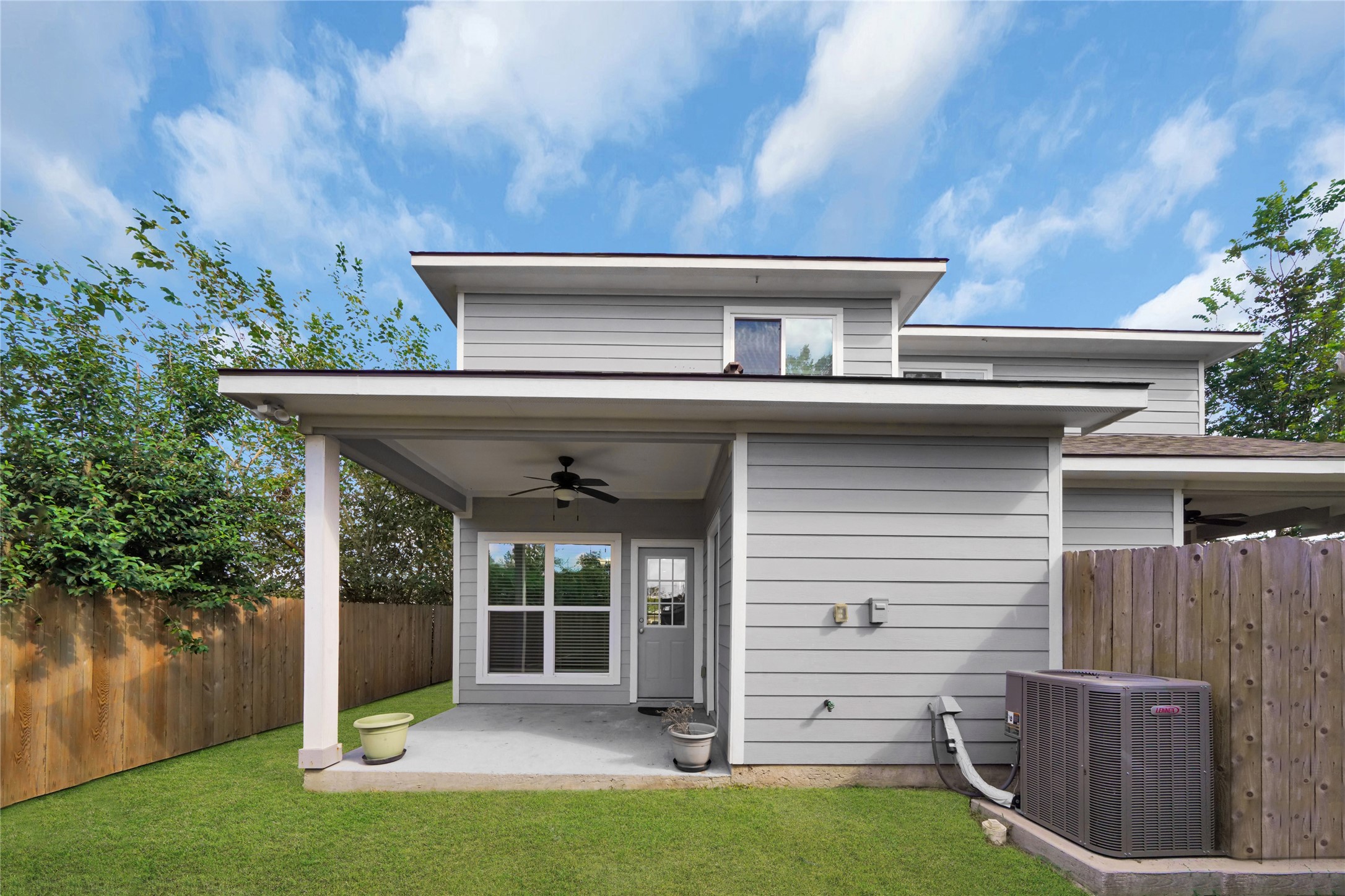 4732 Carmen Street, Unit A Houston, TX 77033 - Photo 26 of 26 a view of a patio with table and chairs with wooden floor and plants