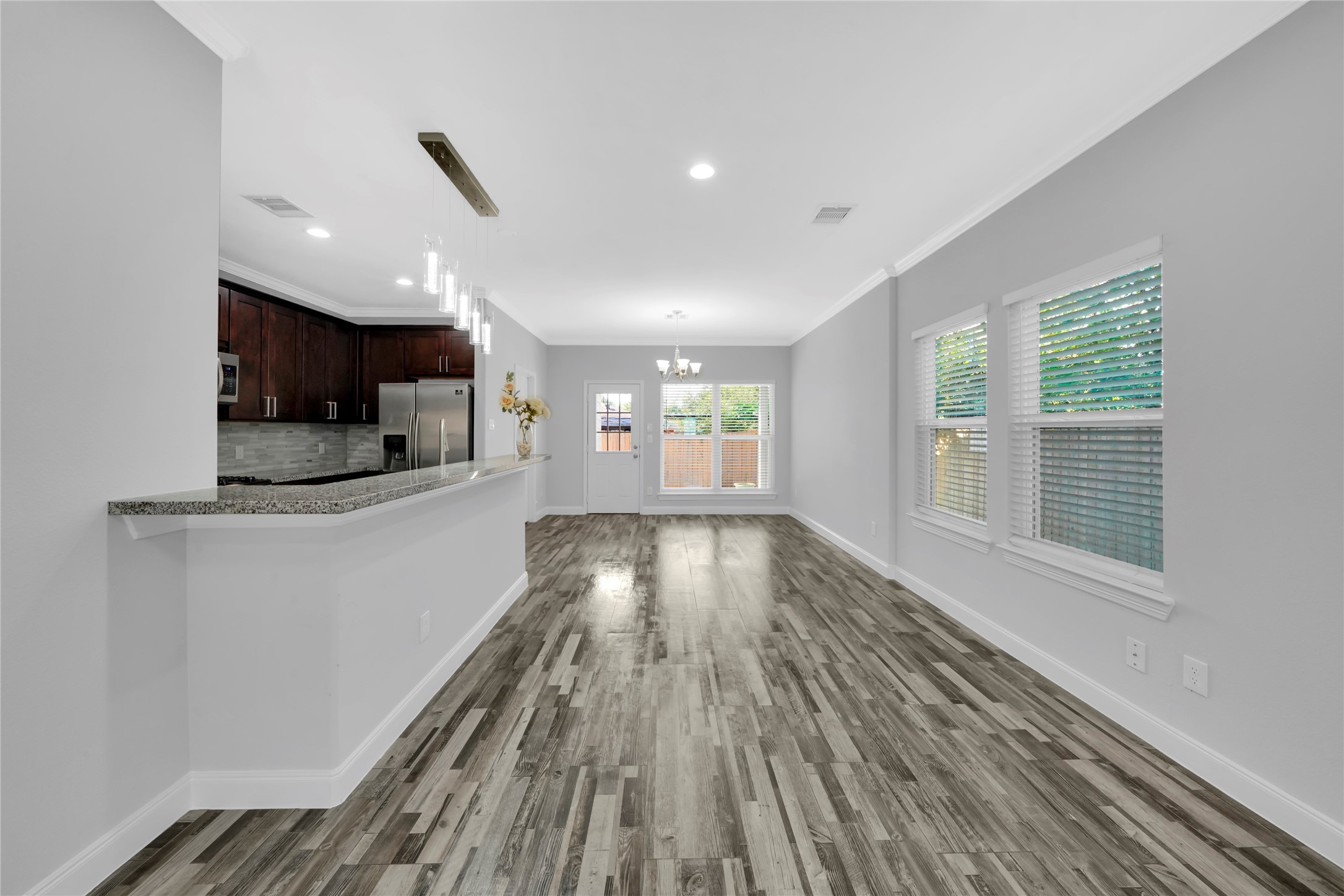 4732 Carmen Street, Unit A Houston, TX 77033 - Photo 5 of 26 a view of kitchen with wooden floor and electronic appliances