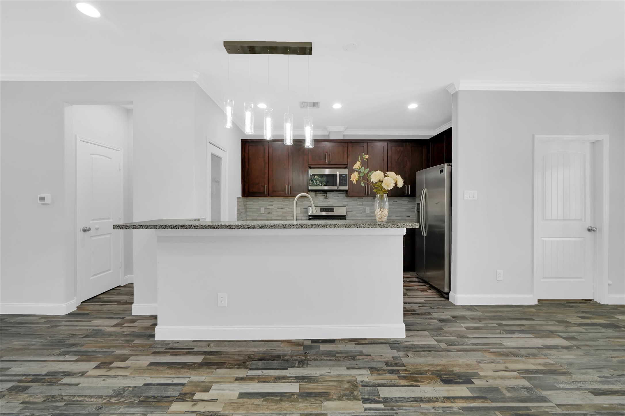 4732 Carmen Street, Unit A Houston, TX 77033 - Photo 9 of 26 a view of kitchen with refrigerator and microwave
