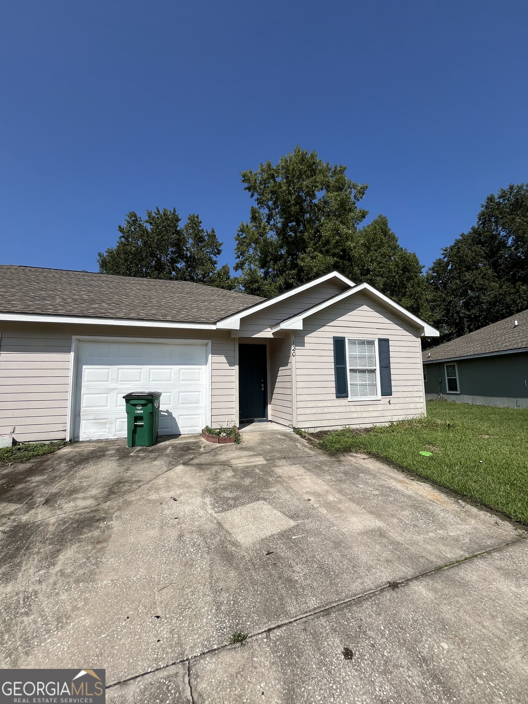 120 Sapelo Drive St. Marys, GA 31558 - Photo 1 of 24 a view of a house with a yard and garage