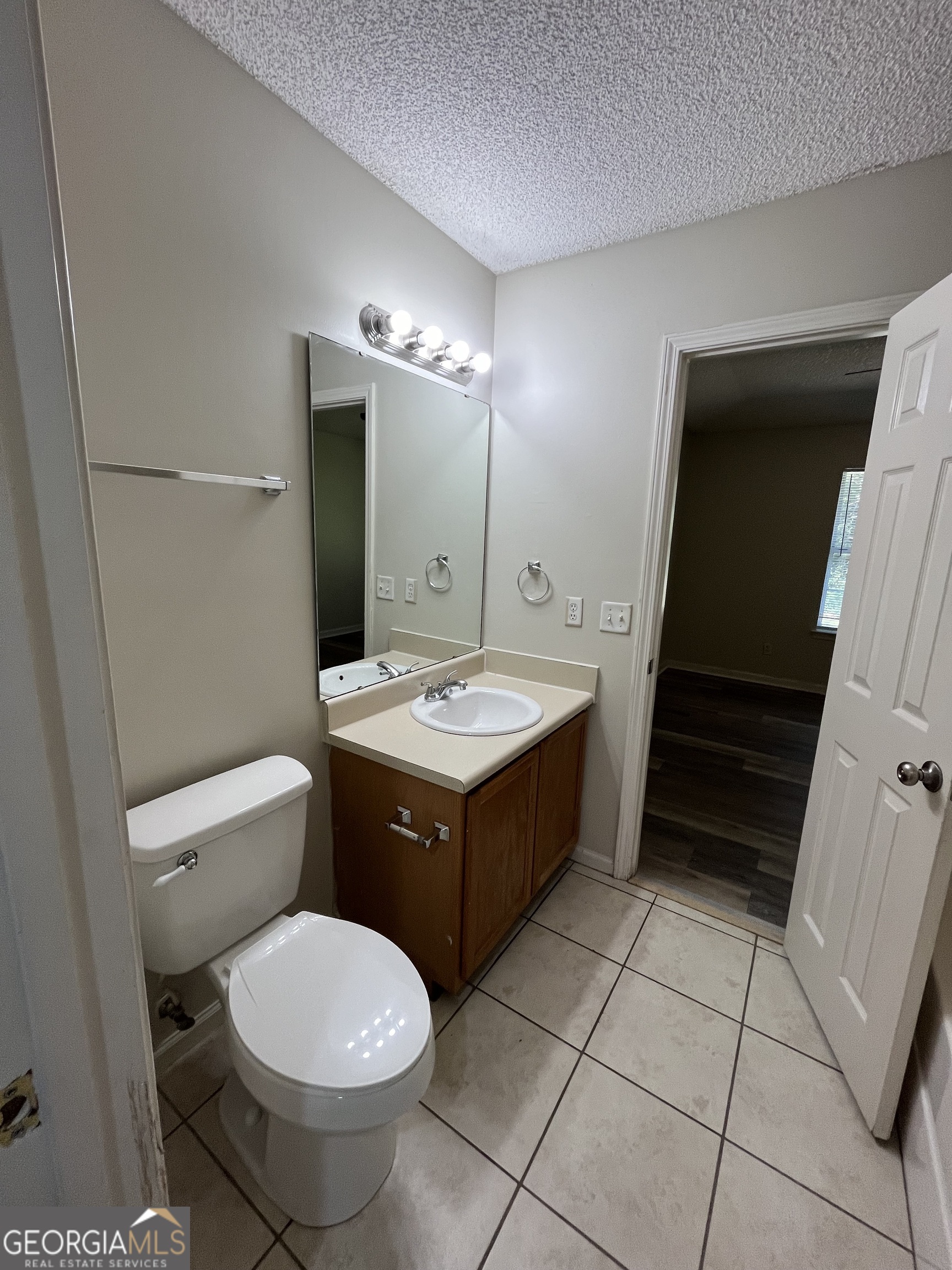 120 Sapelo Drive St. Marys, GA 31558 - Photo 18 of 24 a bathroom with a sink toilet and mirror