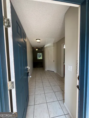 a view of an empty room and fire place