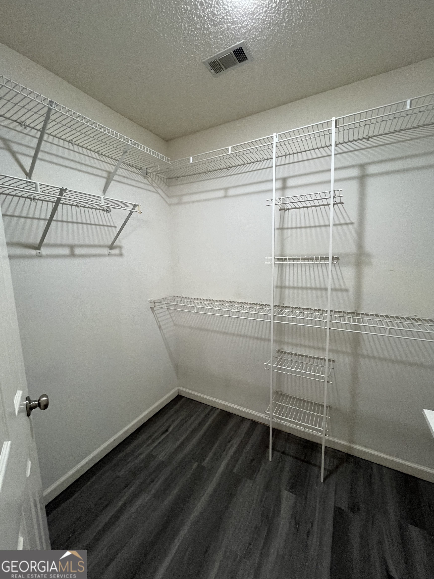 120 Sapelo Drive St. Marys, GA 31558 - Photo 23 of 24 a bathroom with a sink and wooden floor