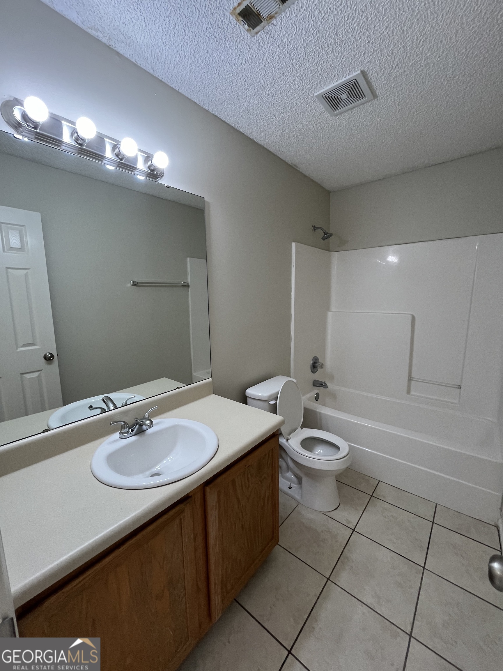 120 Sapelo Drive St. Marys, GA 31558 - Photo 5 of 24 a bathroom with a sink a toilet and mirror