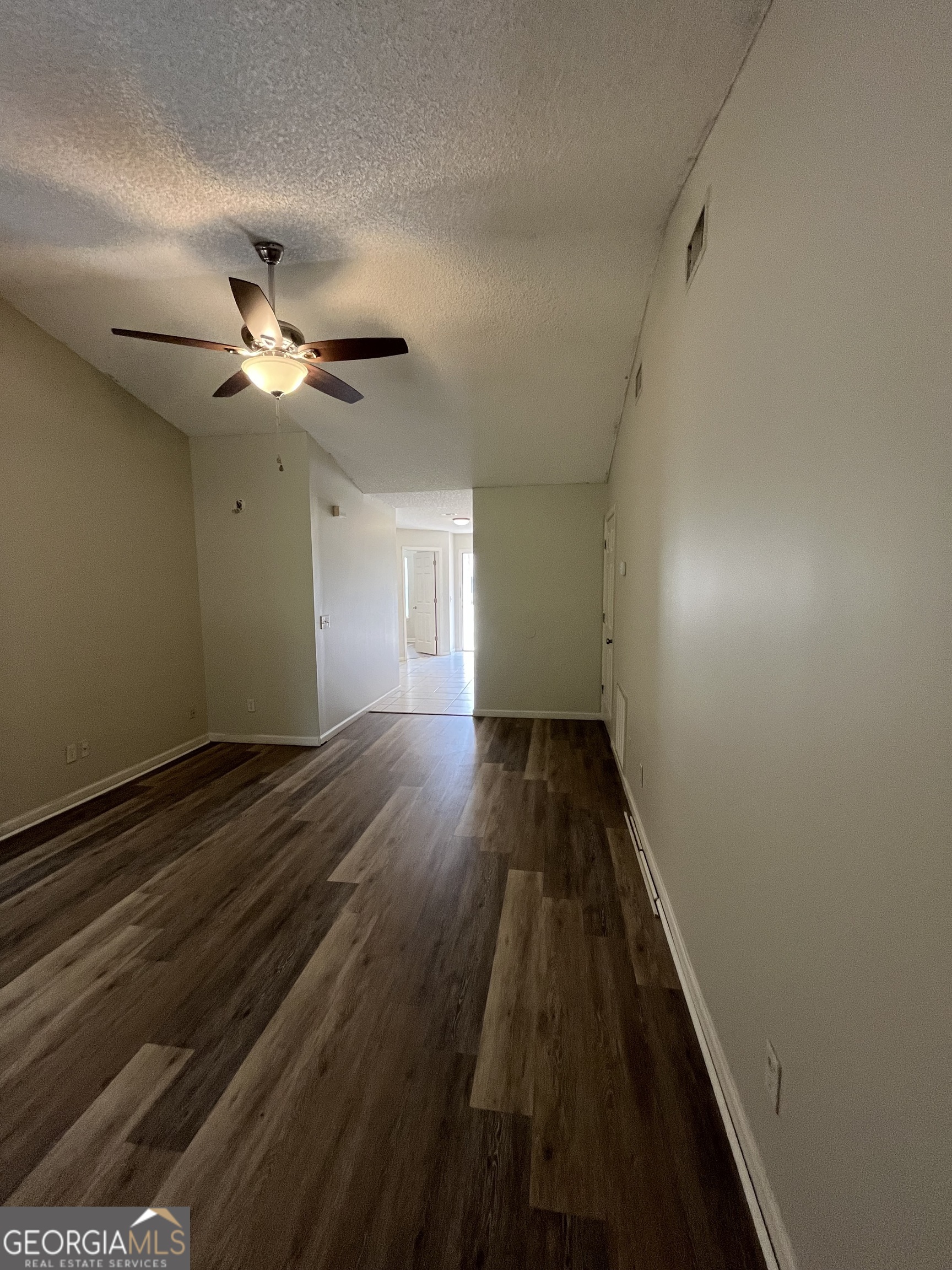 120 Sapelo Drive St. Marys, GA 31558 - Photo 8 of 24 wooden floor in an empty room with a window