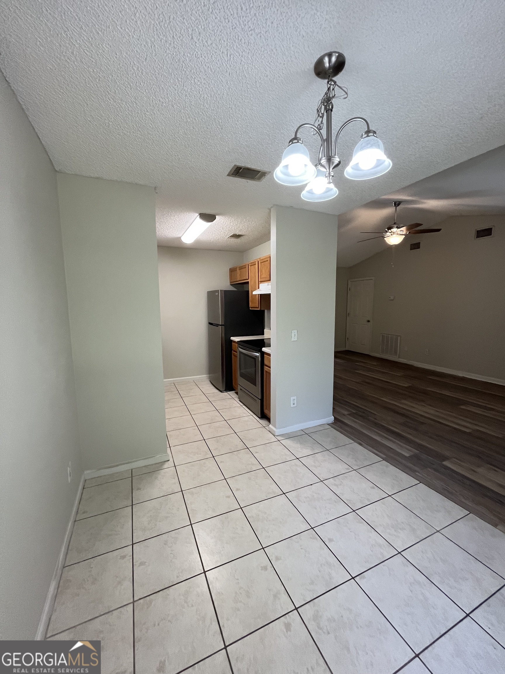 120 Sapelo Drive St. Marys, GA 31558 - Photo 9 of 24 a view of a livingroom with a chandelier fan and furniture