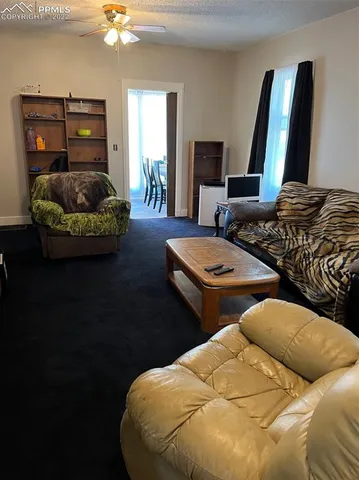 a bedroom with two beds and painting on the wall