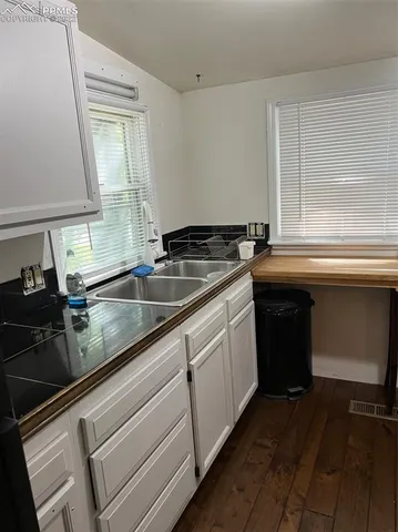 a kitchen that has a sink and a stove