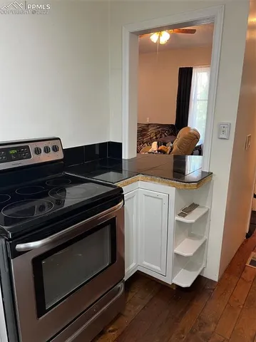 a kitchen with a stove and a microwave