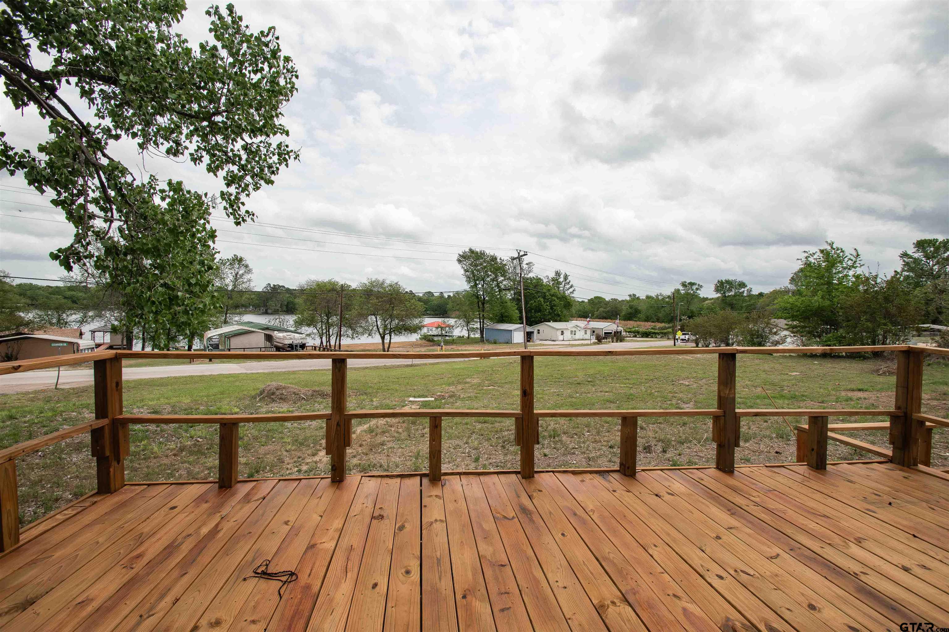 161 Clearview Circle Murchison, TX 75778 - Photo 11 of 47 a view of wooden deck with a lake