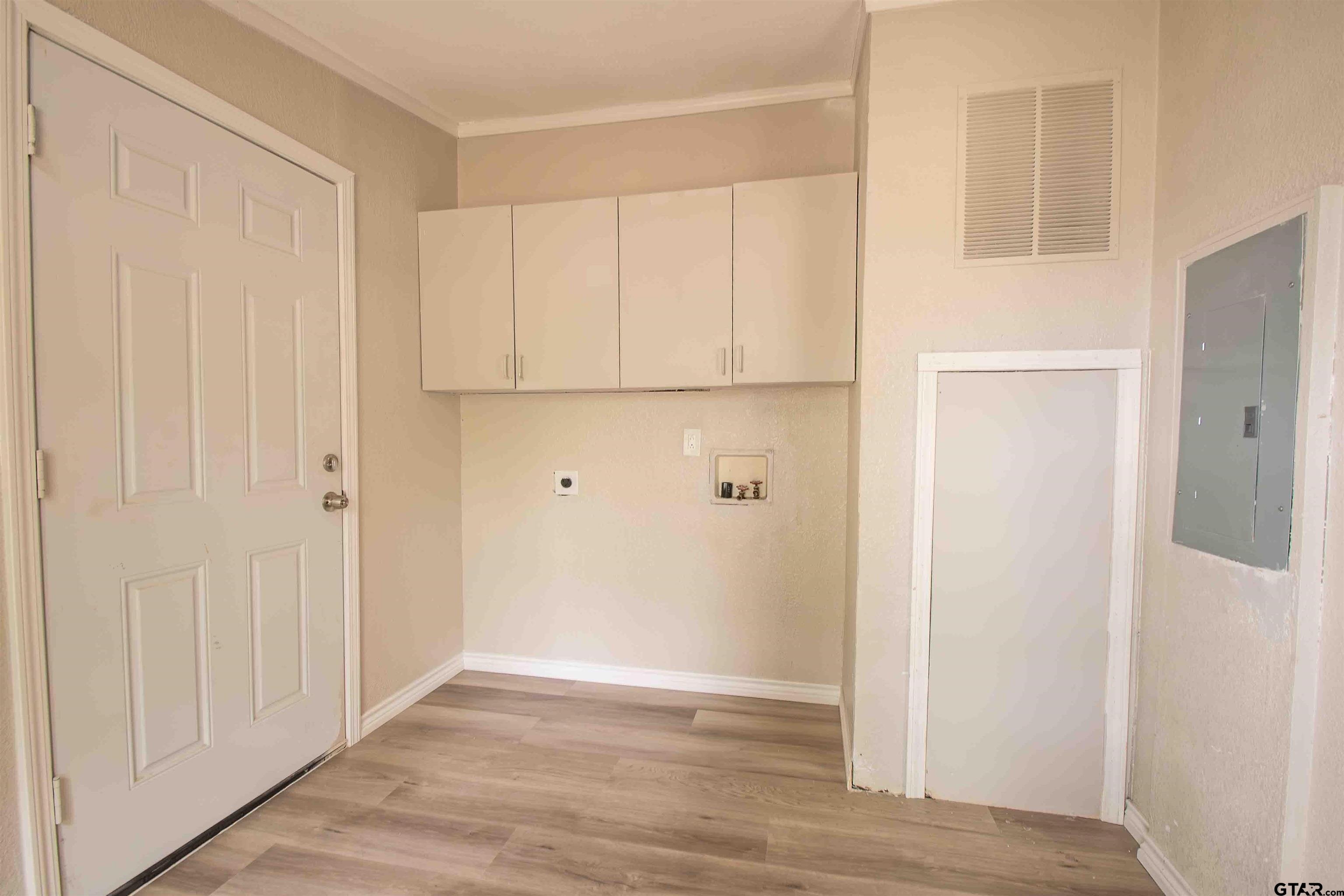 161 Clearview Circle Murchison, TX 75778 - Photo 25 of 47 a view of an empty room with wooden floor